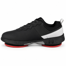 Load image into Gallery viewer, A black low-top curling shoe with a white side stripe, black mesh lining, and a bright red outsole, shown from a side profile on a white background.