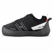 Load image into Gallery viewer, A black curling shoe with white graphic stripes, a white side panel, and a black sole, shown from a side profile on a white background.